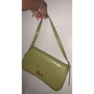 Green croc purse .